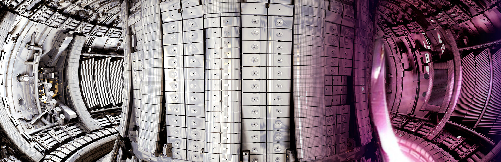 This picture shows a section of plasma (pink – authentic colour) superimposed on JET vessel equipped with the ITER-Like wall. In actuality the plasma would not be confined to a small section of the vessel as in this image, but would extend the whole way around.